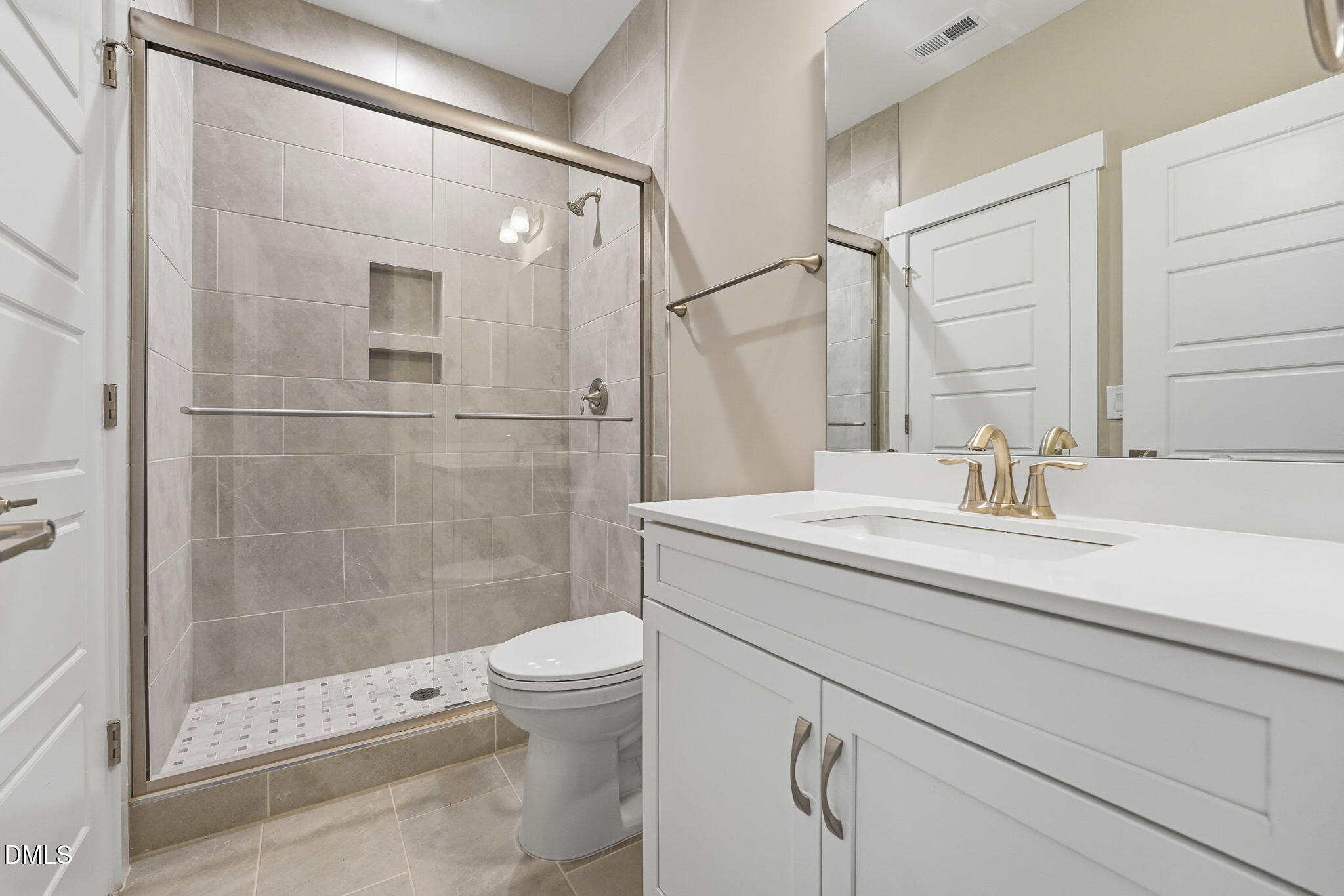 318 Ivy Rdg Road Chapel Hill, NC 27516 - Photo 37 of 47 a bathroom with a shower sink vanity mirror and toilet