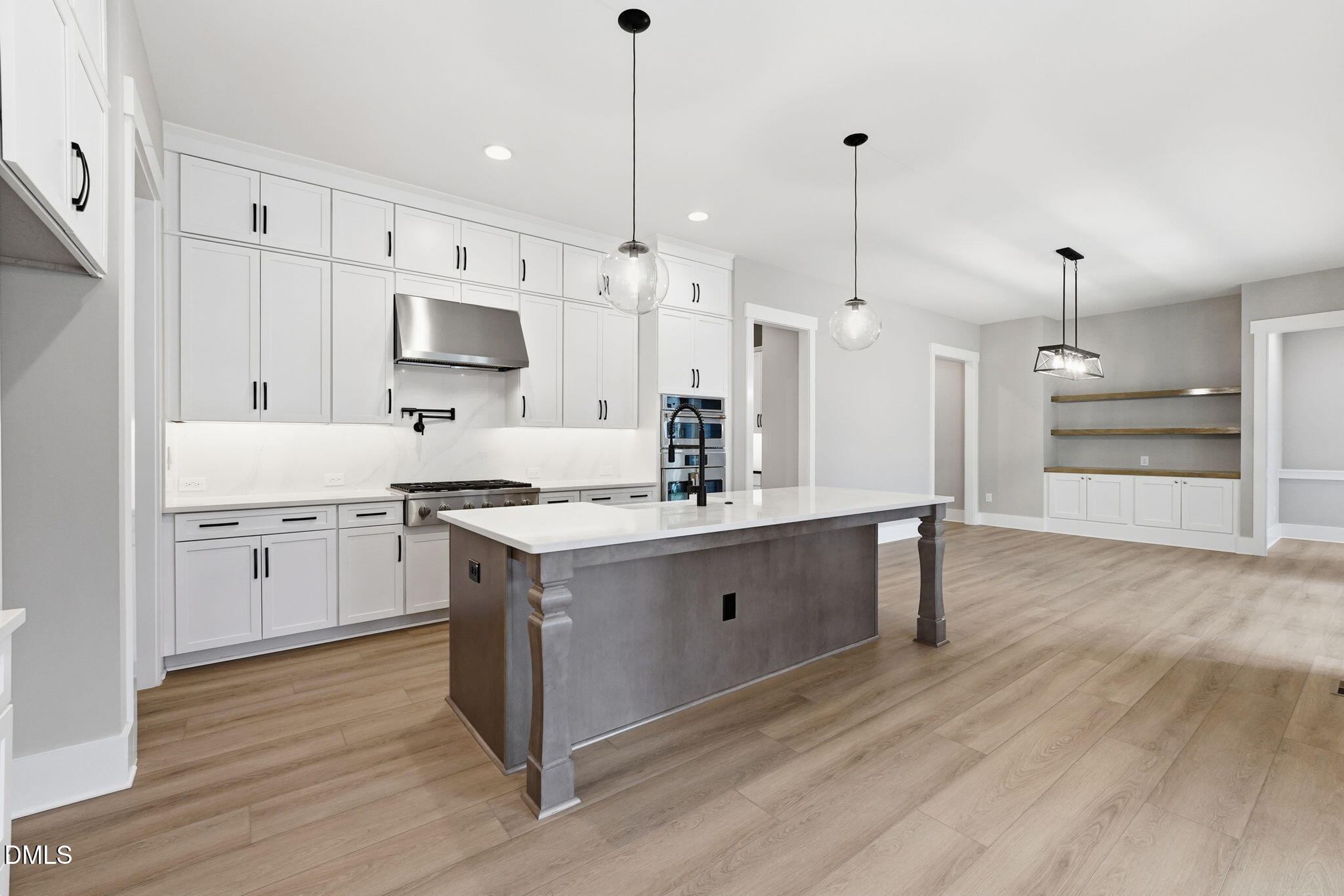318 Ivy Rdg Road Chapel Hill, NC 27516 - Photo 5 of 47 a kitchen with kitchen island white cabinets stainless steel appliances and sink