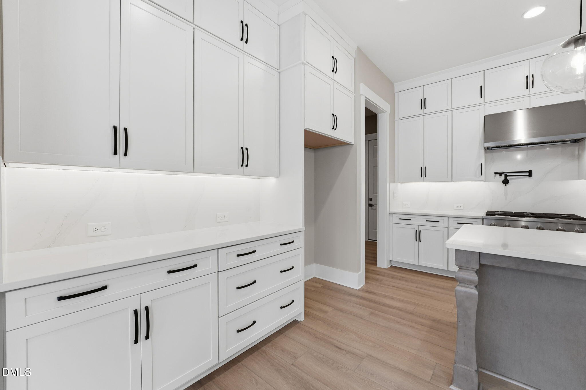 318 Ivy Rdg Road Chapel Hill, NC 27516 - Photo 6 of 47 a kitchen with cabinets appliances and a wooden floor