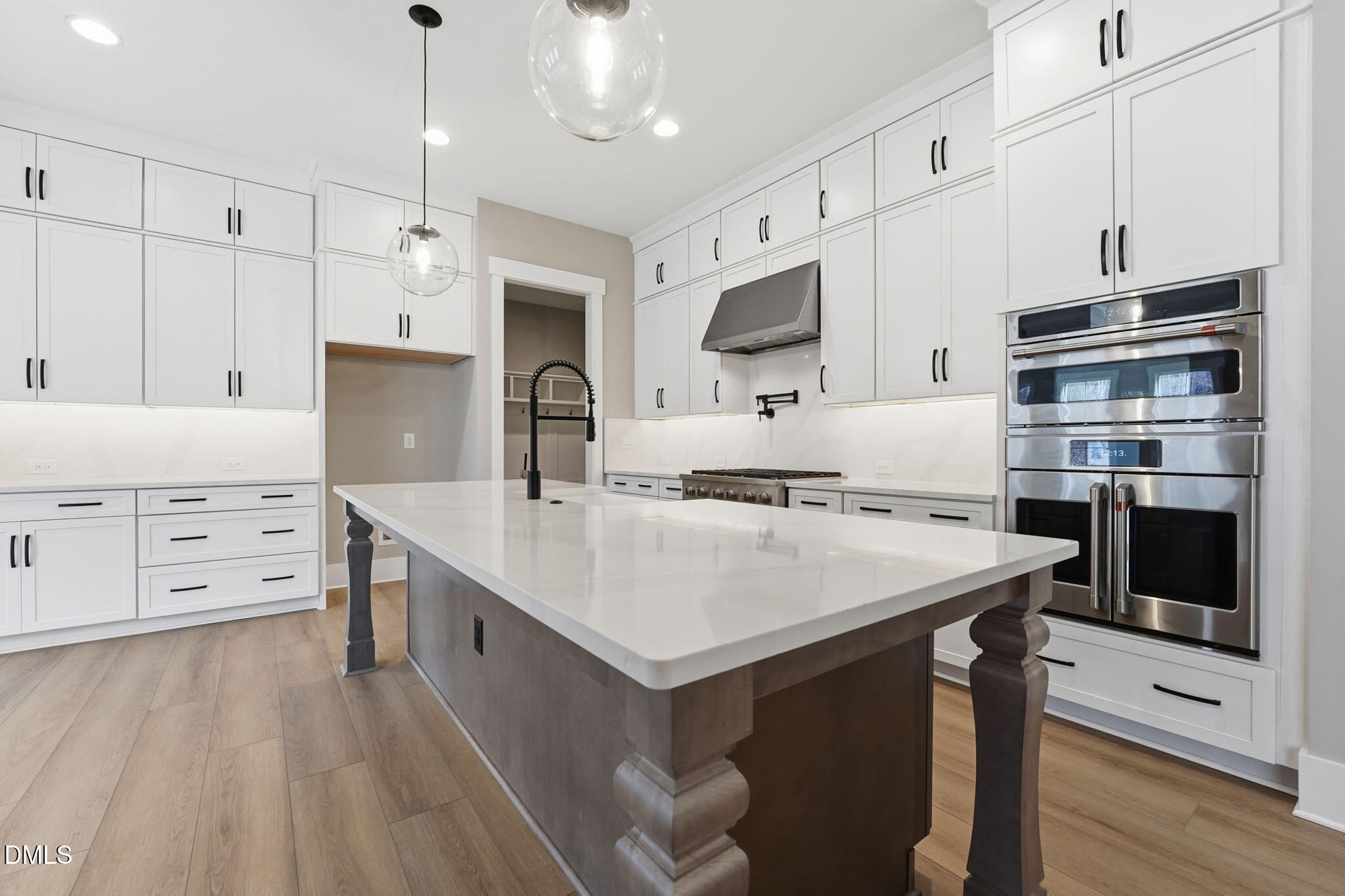 318 Ivy Rdg Road Chapel Hill, NC 27516 - Photo 7 of 47 a kitchen with stainless steel appliances a stove refrigerator sink and cabinets