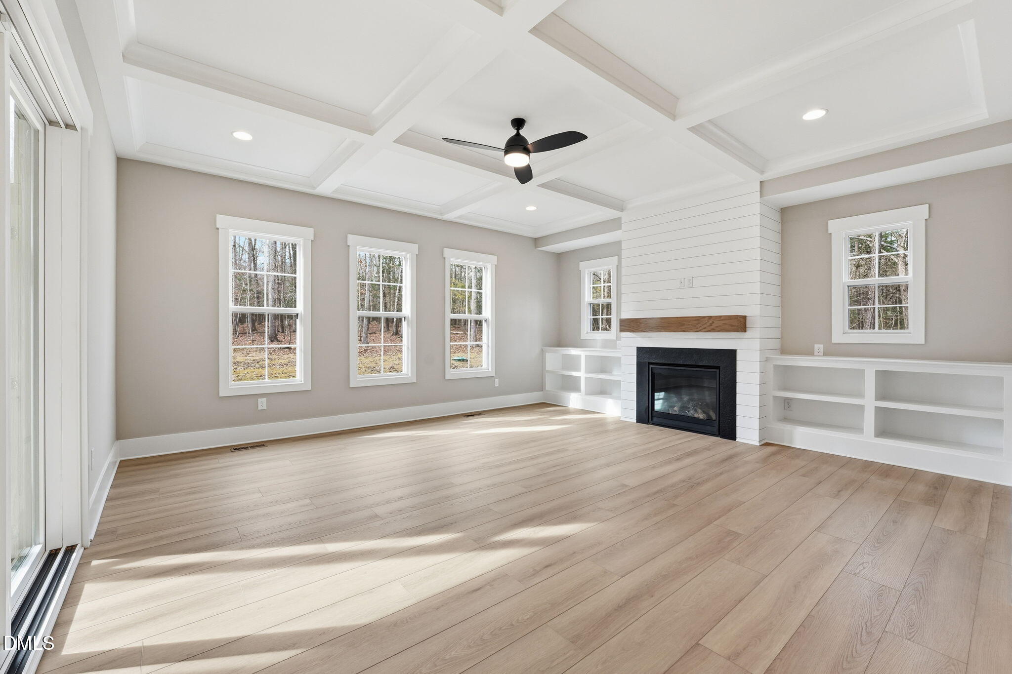 318 Ivy Rdg Road Chapel Hill, NC 27516 - Photo 8 of 47 a view of an empty room with wooden floor and a window