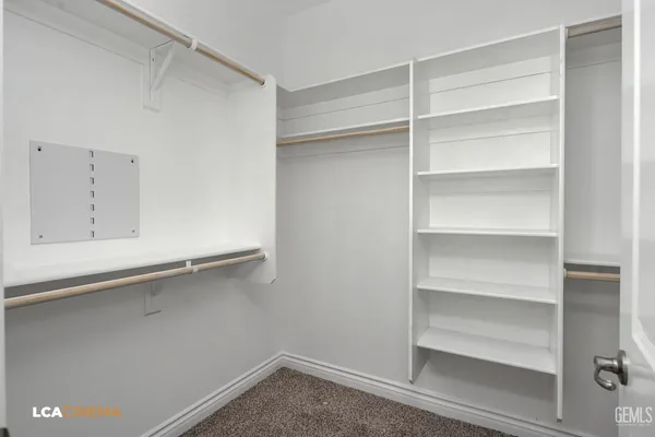 a view of an empty walk in closet