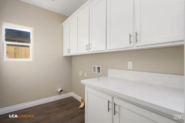 a view of cabinets and wooden floor