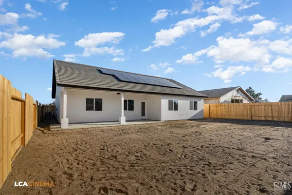 a house with trees in the background