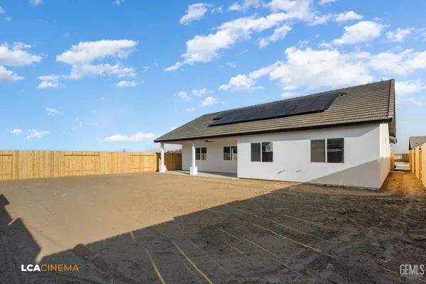 a house view with a backyard space