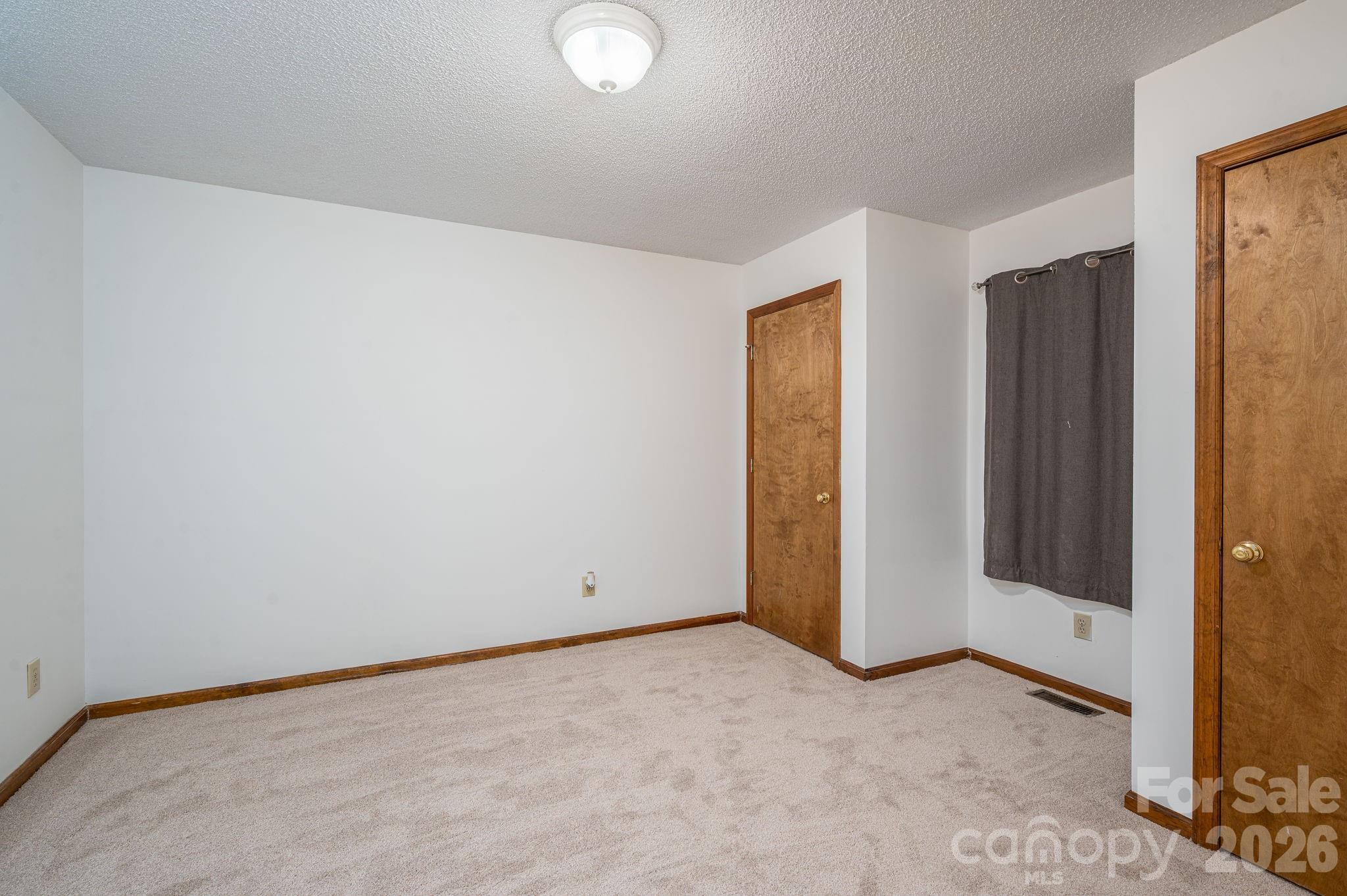 480 South Ingleside Farm Road Iron Station, NC 28080 - Photo 18 of 42 an empty room with closet