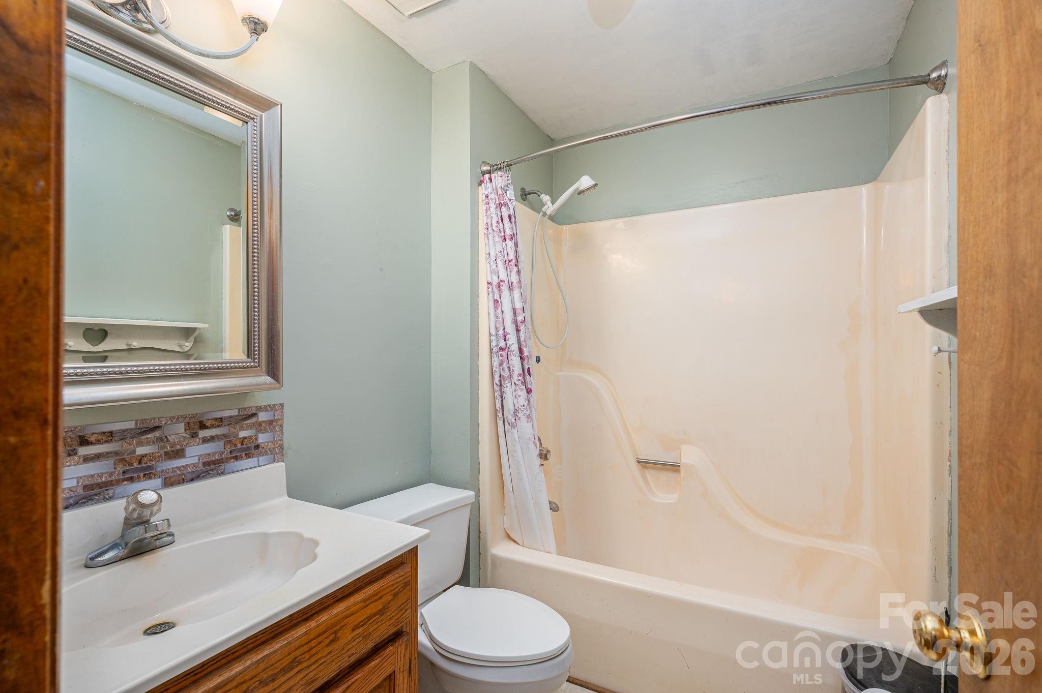 480 South Ingleside Farm Road Iron Station, NC 28080 - Photo 20 of 42 a bathroom with a sink toilet and shower