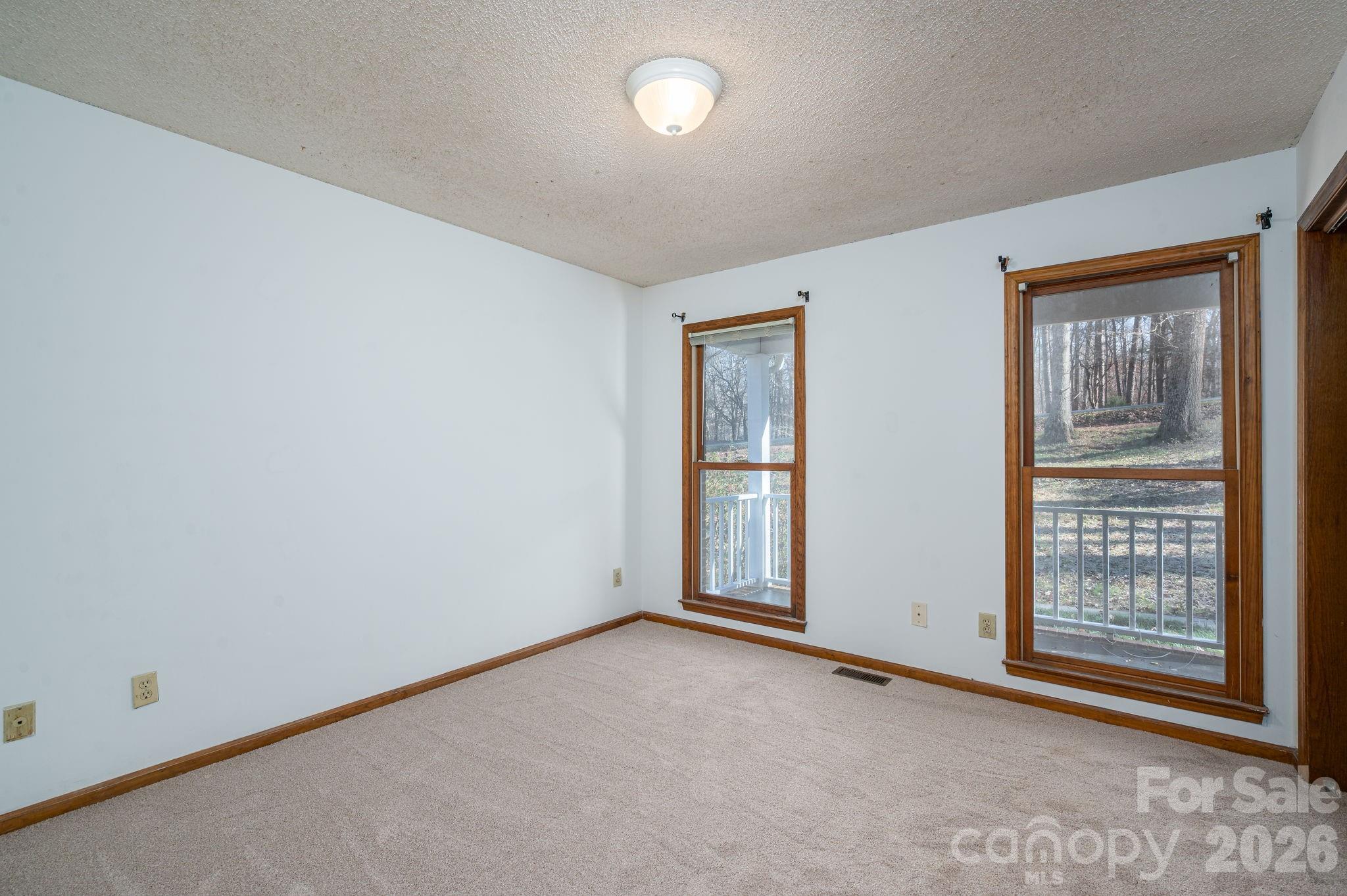 480 South Ingleside Farm Road Iron Station, NC 28080 - Photo 21 of 42 an empty room with windows