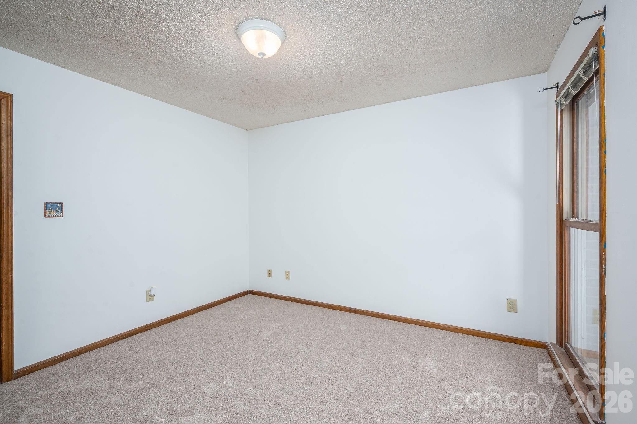 480 South Ingleside Farm Road Iron Station, NC 28080 - Photo 22 of 42 an empty room with a empty space and window