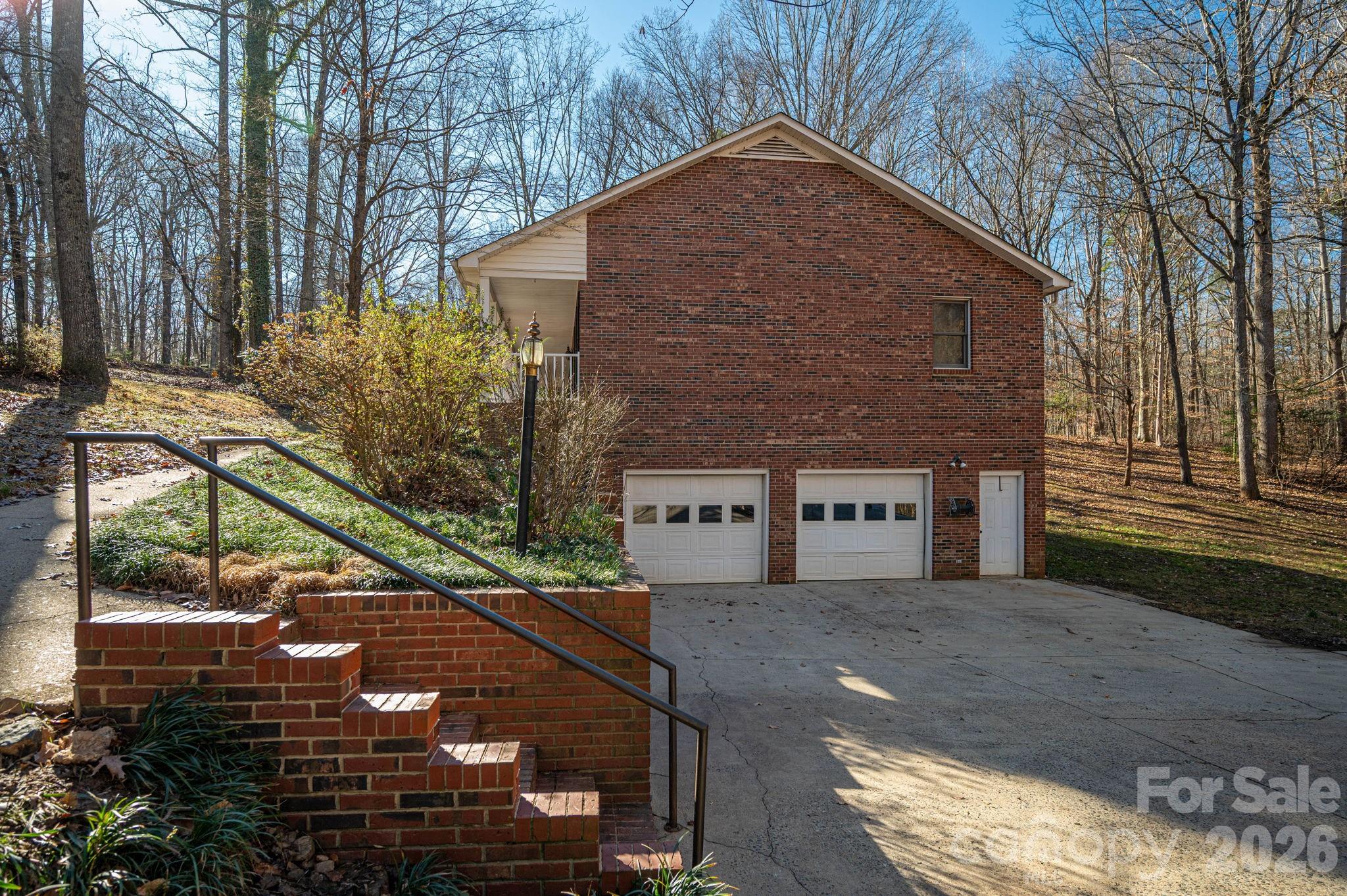 480 South Ingleside Farm Road Iron Station, NC 28080 - Photo 35 of 42 a brick building with large windows