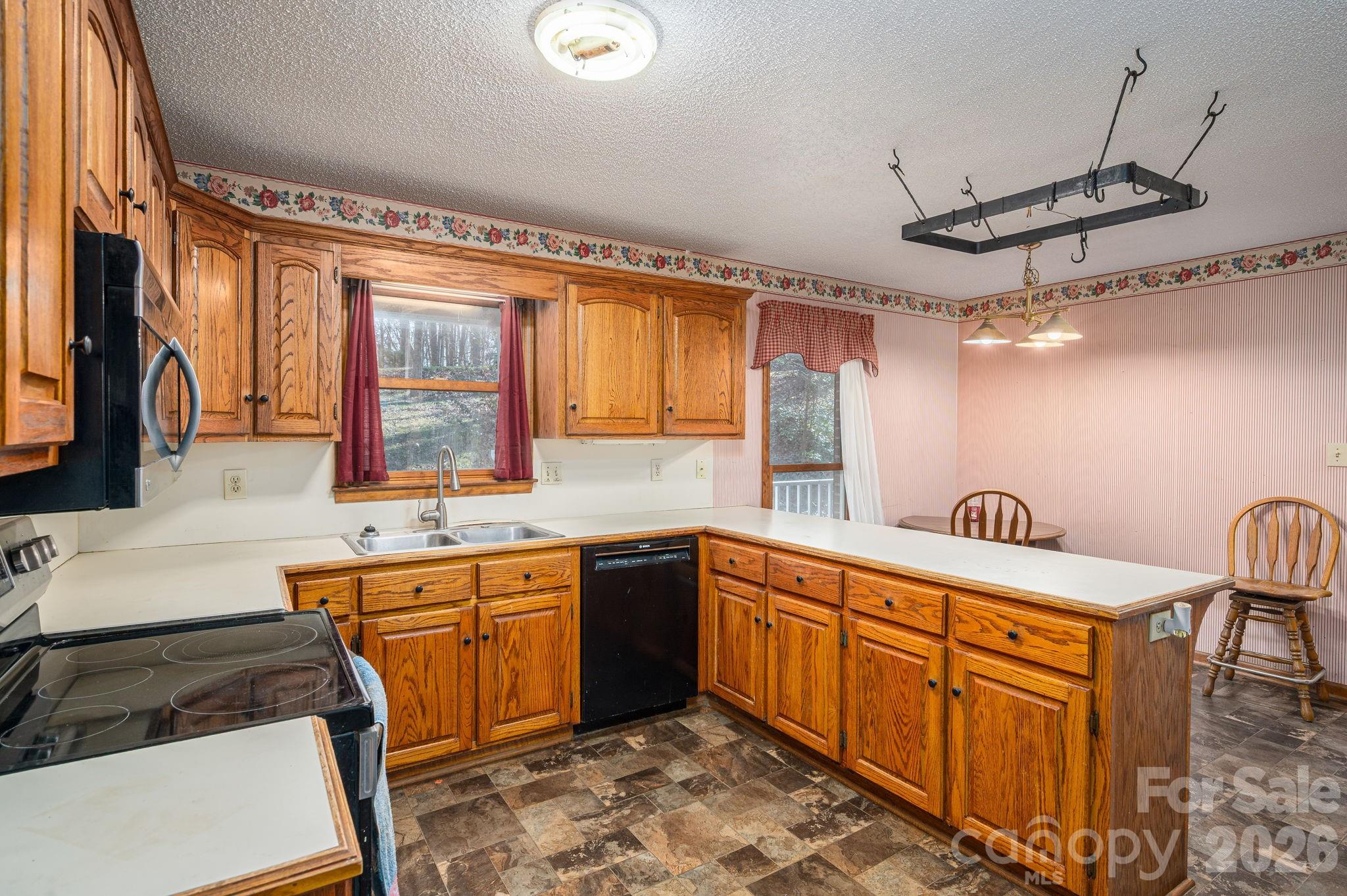 480 South Ingleside Farm Road Iron Station, NC 28080 - Photo 7 of 42 a spacious bathroom with a sink a bathtub and a double vanity sink