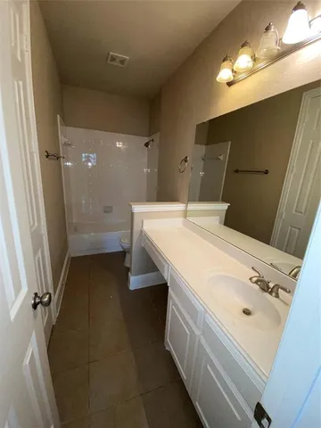 a view of an empty room with a fireplace