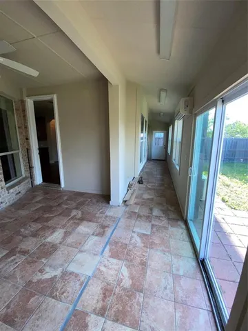 a kitchen with kitchen island granite countertop a refrigerator stove top oven and sink