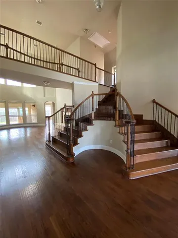 a view of staircase with white walls and a window