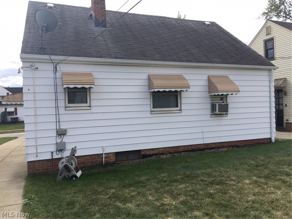 11715 Crofton Road Cleveland, OH 44125 - Photo 11 of 15 REAR VIEW OF HOME SQUIRES ROOF