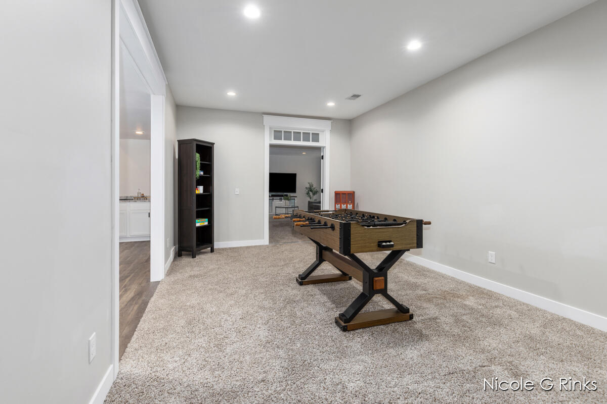 9860 Button Road Belding, MI 48809 - Photo 34 of 63 9860 Button Lower game room