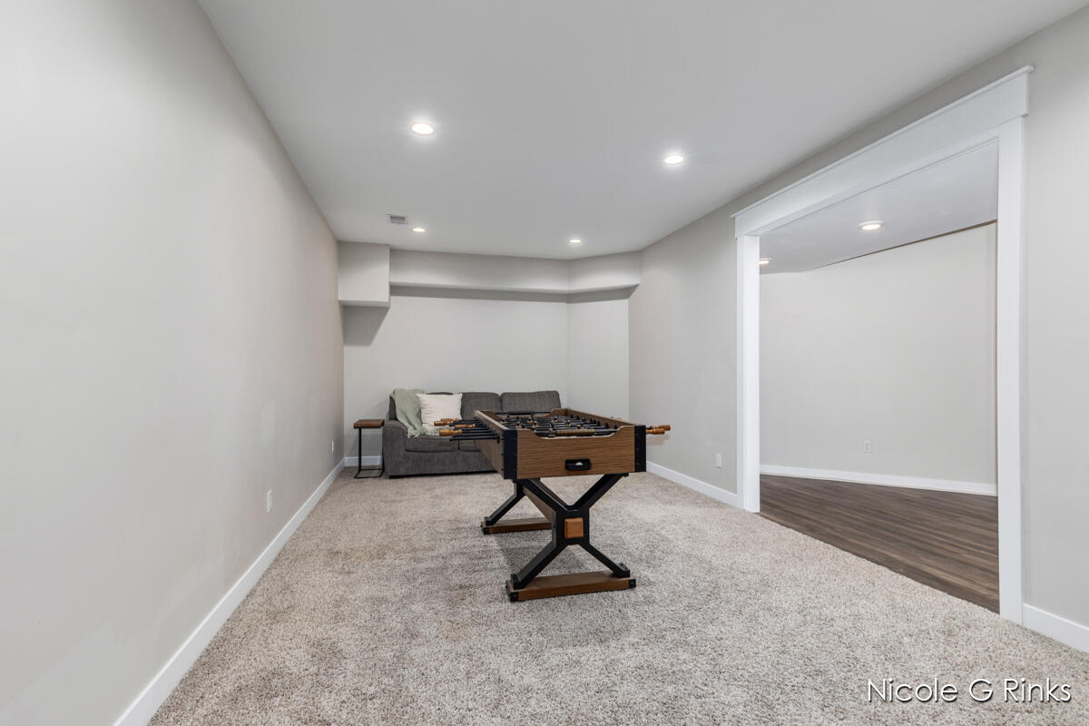 9860 Button Road Belding, MI 48809 - Photo 35 of 63 9860 Button Lower game room