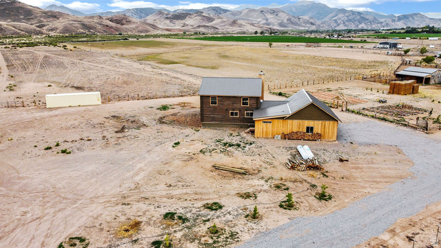 544 East 600 North, Unit 1 Joseph, UT 84739 - Photo 44 of 65 Rural property featuring a two-story residence with a metal roof and a detached outbuilding with natural wood siding