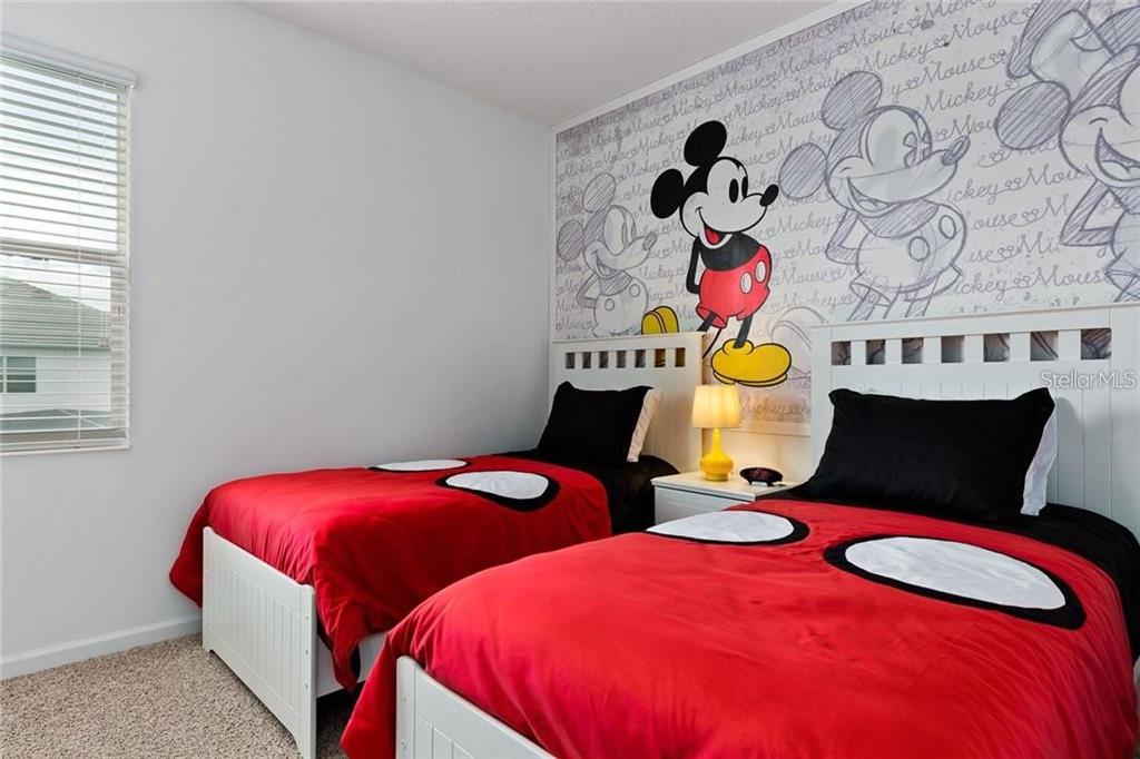 2626 Calistoga Avenue Kissimmee, FL 34741 - Photo 13 of 43 a bedroom with two beds and a window