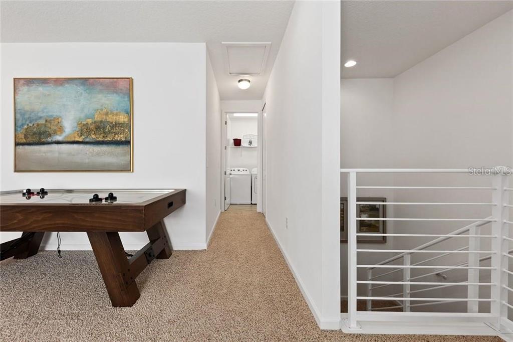 2626 Calistoga Avenue Kissimmee, FL 34741 - Photo 18 of 43 a view of a workspace with furniture and cabinet