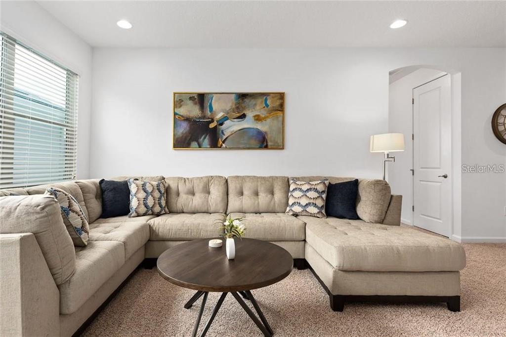 2626 Calistoga Avenue Kissimmee, FL 34741 - Photo 19 of 43 a living room with furniture and a large window