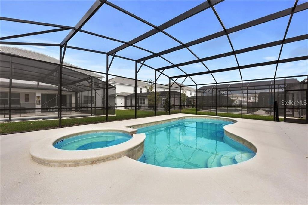 2626 Calistoga Avenue Kissimmee, FL 34741 - Photo 3 of 43 a view of a swimming pool with a yard