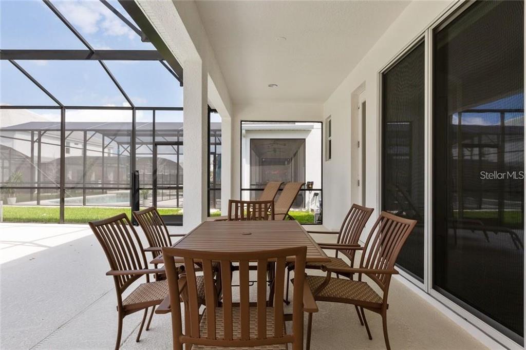 2626 Calistoga Avenue Kissimmee, FL 34741 - Photo 43 of 43 a view of a dining room with furniture window and outside view