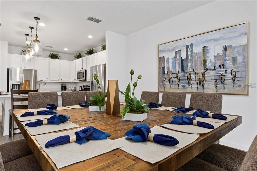 2626 Calistoga Avenue Kissimmee, FL 34741 - Photo 10 of 43 a living room with lots of furniture and kitchen view