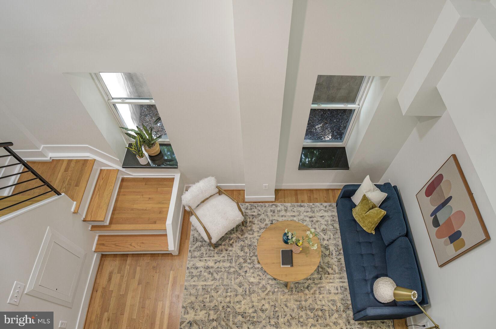 1437 Rhode Island Avenue Northwest, Unit 101 Washington, DC 20005 - Photo 1 of 36 a living room with furniture and wooden floor