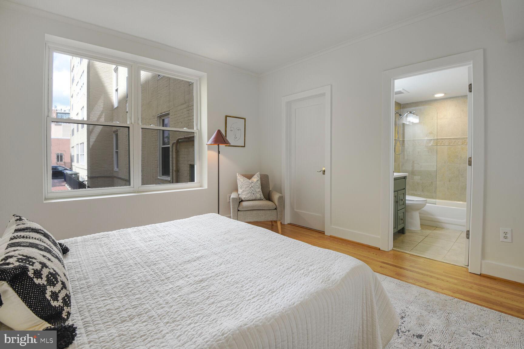 1437 Rhode Island Avenue Northwest, Unit 101 Washington, DC 20005 - Photo 13 of 36 a bedroom with a bed and a large window