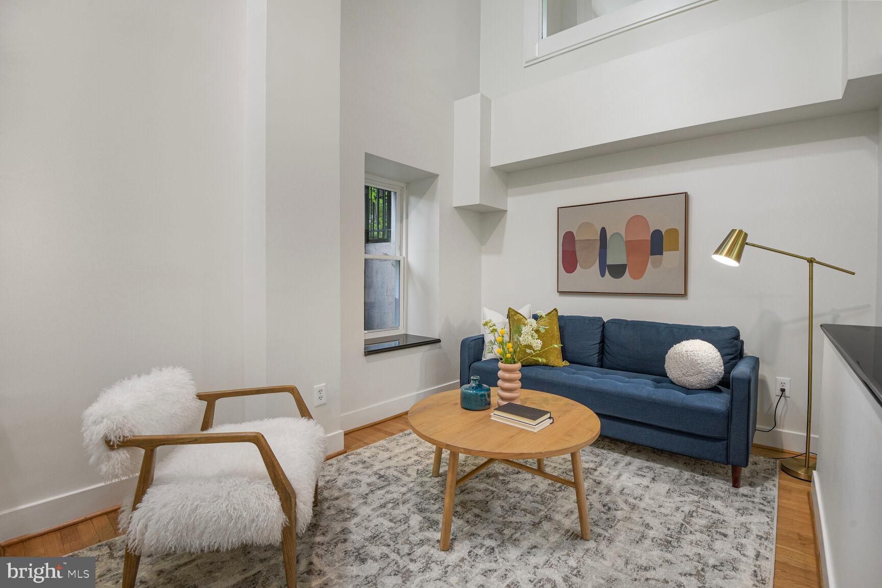 1437 Rhode Island Avenue Northwest, Unit 101 Washington, DC 20005 - Photo 18 of 36 a living room with furniture and wooden floor