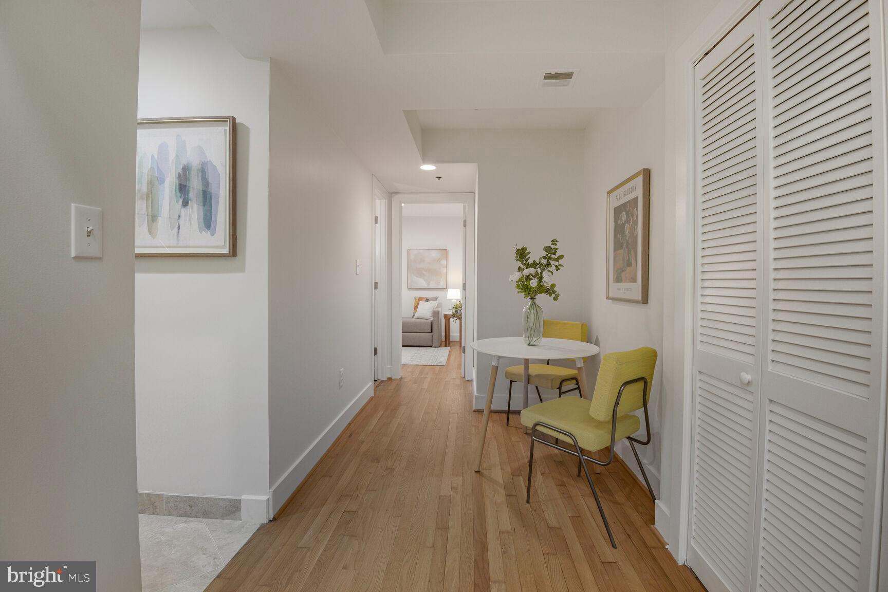 1437 Rhode Island Avenue Northwest, Unit 101 Washington, DC 20005 - Photo 21 of 36 a workspace room with wooden floor table and chairs