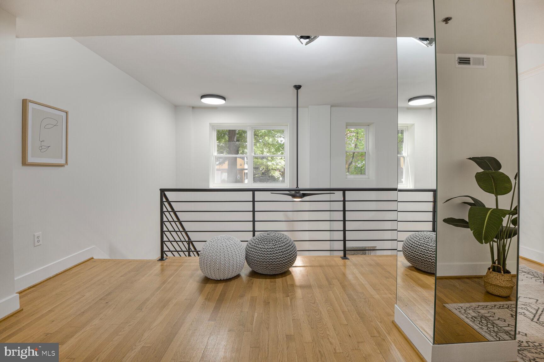 1437 Rhode Island Avenue Northwest, Unit 101 Washington, DC 20005 - Photo 10 of 36 a view of a living room and hardwood floor