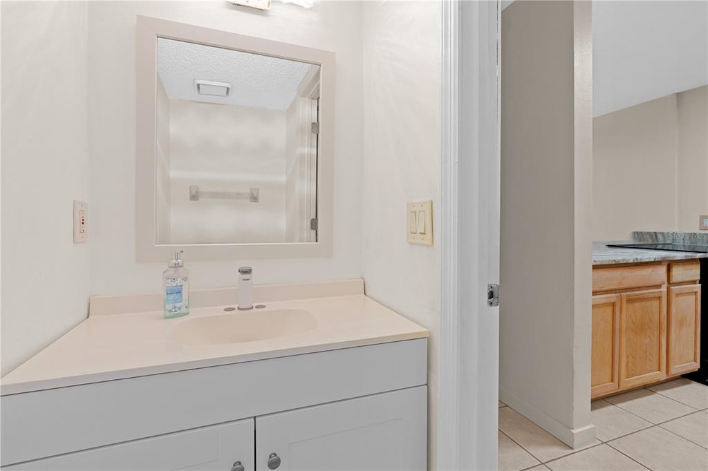 2302 South Maki Road, Unit 66 Plant City, FL 33563 - Photo 14 of 35 a bathroom with a sink and a mirror