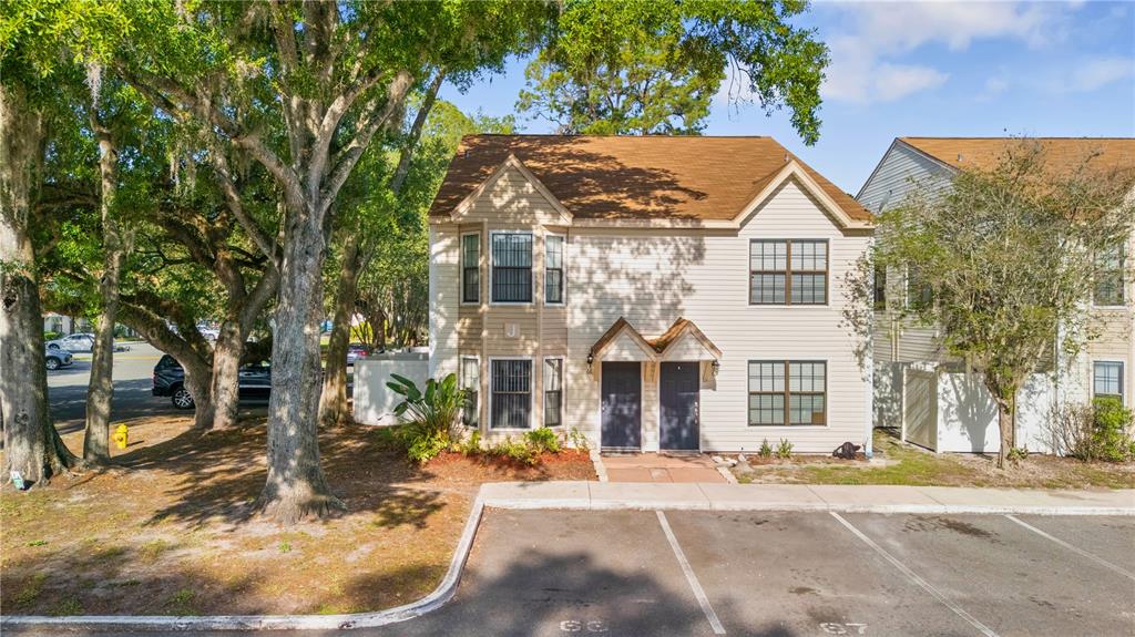 2302 South Maki Road, Unit 66 Plant City, FL 33563 - Photo 34 of 35 a front view of a house with a yard