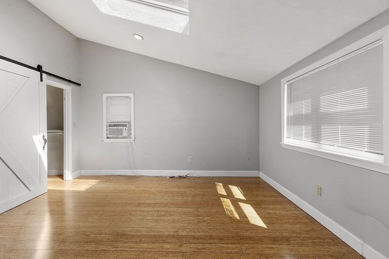150 Windsor Avenue Swampscott, MA 01907 - Photo 13 of 39 wooden floor in an empty room with a window