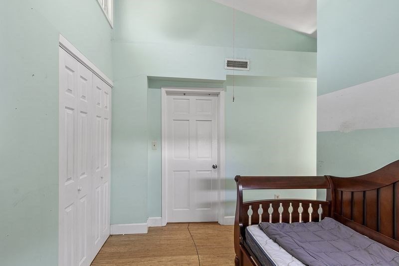 150 Windsor Avenue Swampscott, MA 01907 - Photo 18 of 39 a bedroom with a bed and wooden floor