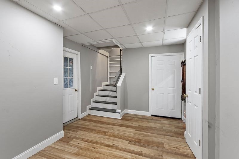 150 Windsor Avenue Swampscott, MA 01907 - Photo 20 of 39 a view of entryway with stairs and wooden floor