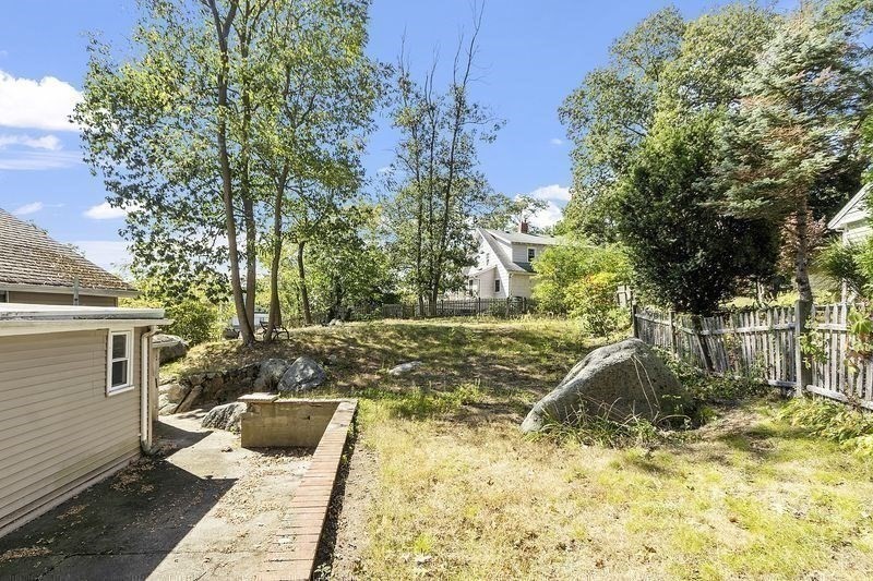 150 Windsor Avenue Swampscott, MA 01907 - Photo 32 of 39 a view of a yard with wooden fence