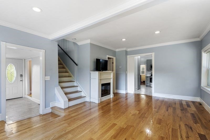 150 Windsor Avenue Swampscott, MA 01907 - Photo 6 of 39 a view of a livingroom with wooden floor and staircase
