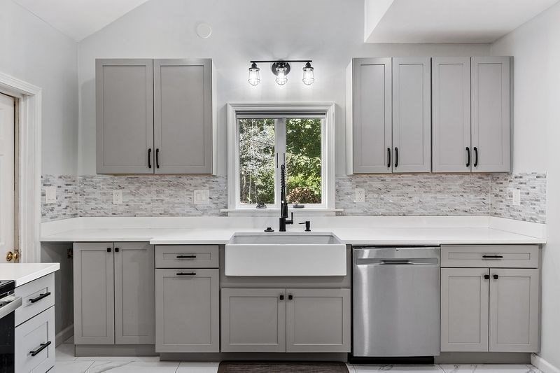 150 Windsor Avenue Swampscott, MA 01907 - Photo 9 of 39 a kitchen with cabinets appliances and a sink