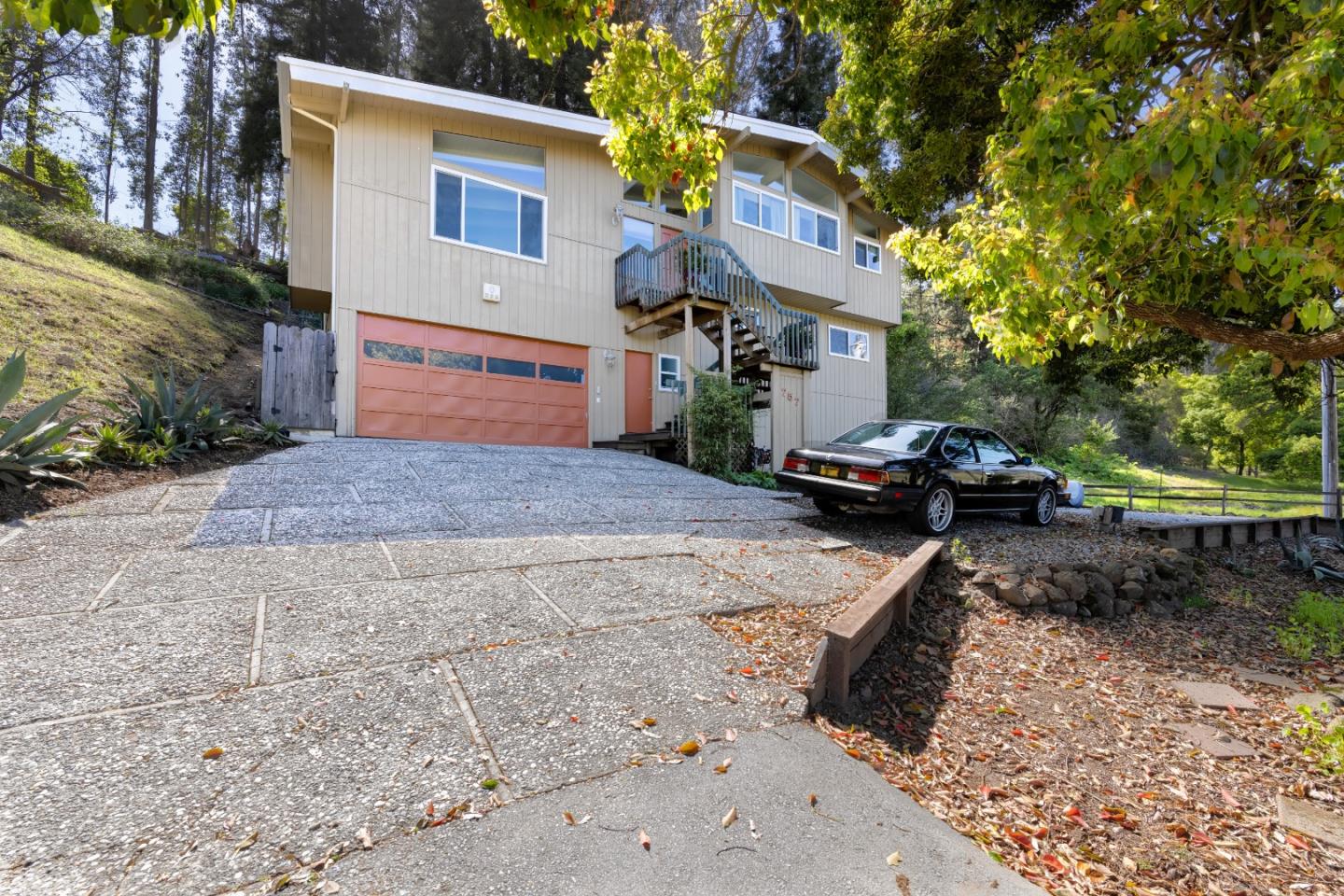 757 Pleasant Valley Road Aptos, CA 95003 - Photo 1 of 41 a front view of a house with a yard