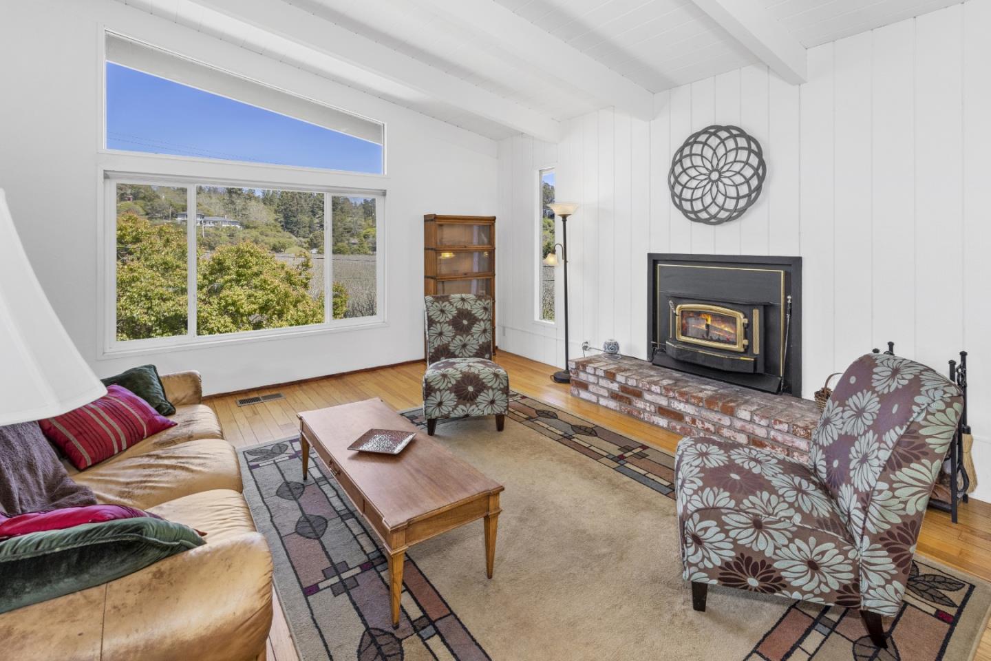 757 Pleasant Valley Road Aptos, CA 95003 - Photo 13 of 41 a living room with furniture and a fireplace