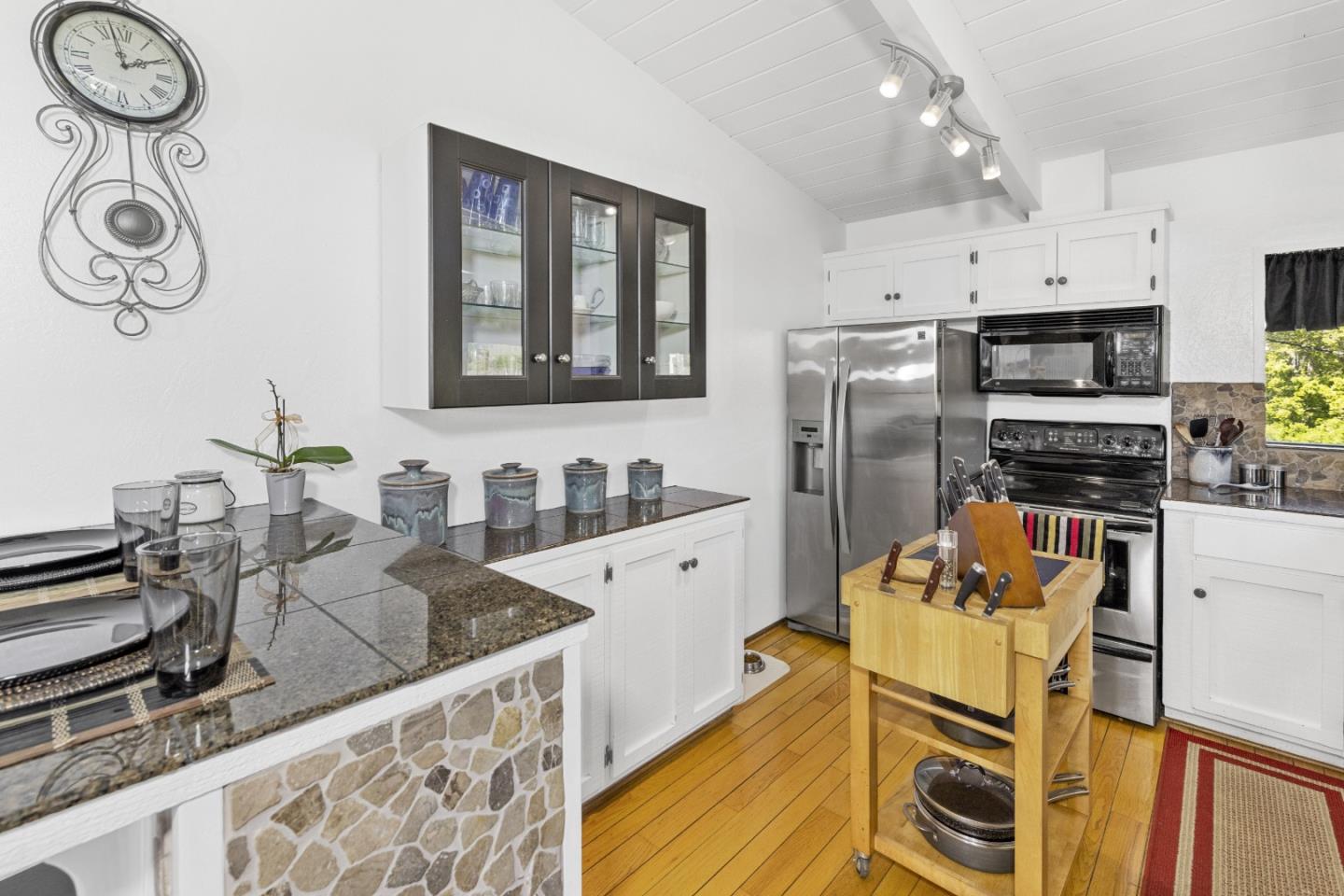 757 Pleasant Valley Road Aptos, CA 95003 - Photo 18 of 41 a kitchen with stainless steel appliances granite countertop a sink and a stove