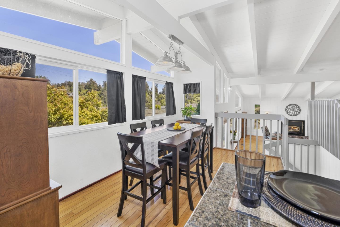 757 Pleasant Valley Road Aptos, CA 95003 - Photo 20 of 41 a view of a dining room with furniture window and wooden floor