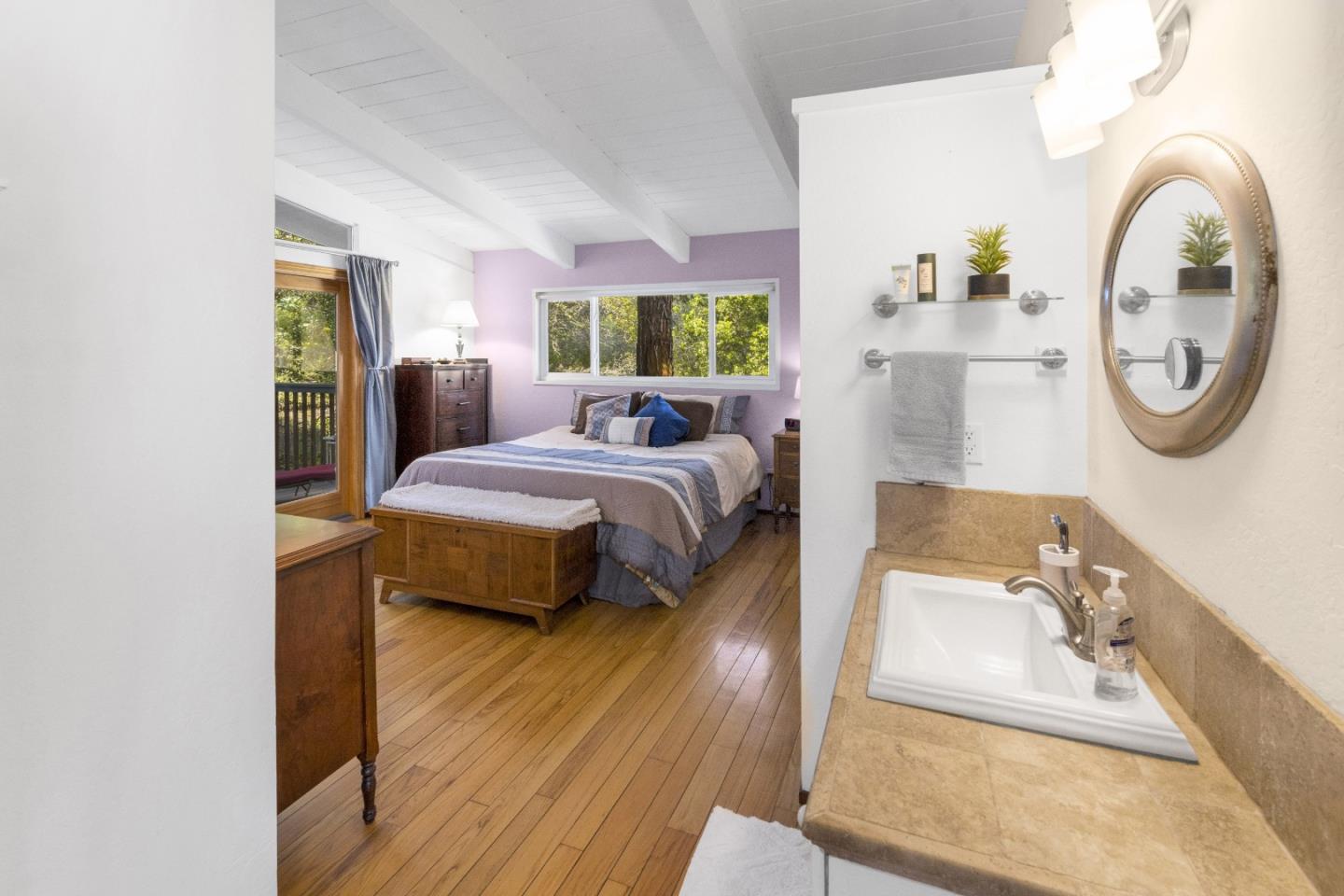 757 Pleasant Valley Road Aptos, CA 95003 - Photo 24 of 41 a spacious bedroom with a bed and a large window