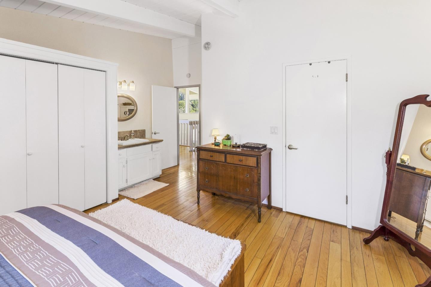 757 Pleasant Valley Road Aptos, CA 95003 - Photo 26 of 41 a bed room with a bed and a television