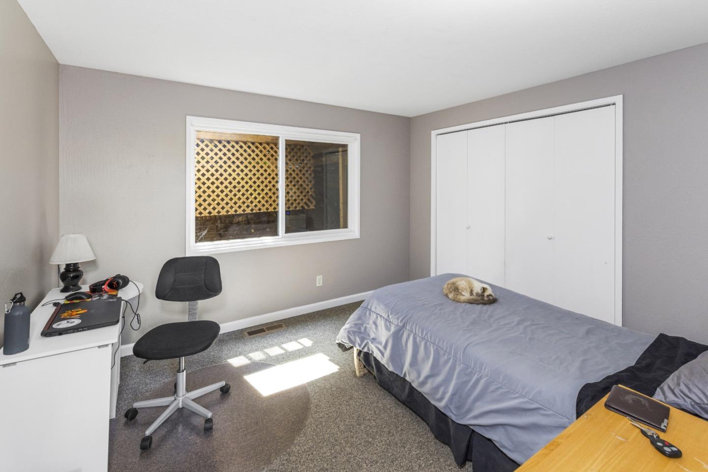 757 Pleasant Valley Road Aptos, CA 95003 - Photo 27 of 41 a bedroom with a bed and a large window
