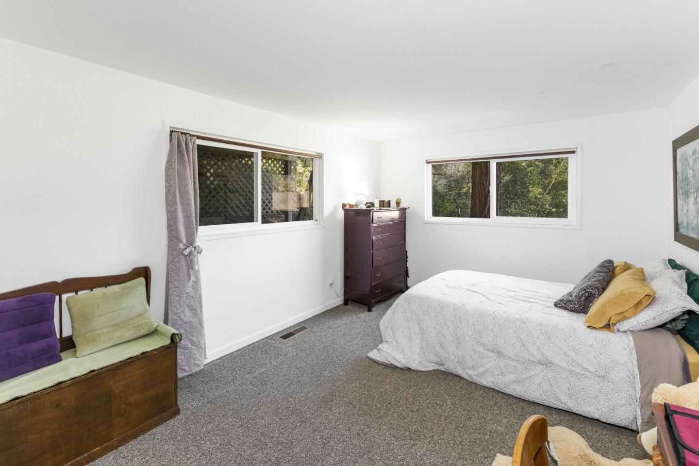 757 Pleasant Valley Road Aptos, CA 95003 - Photo 30 of 41 a bedroom with a bed and wooden floor