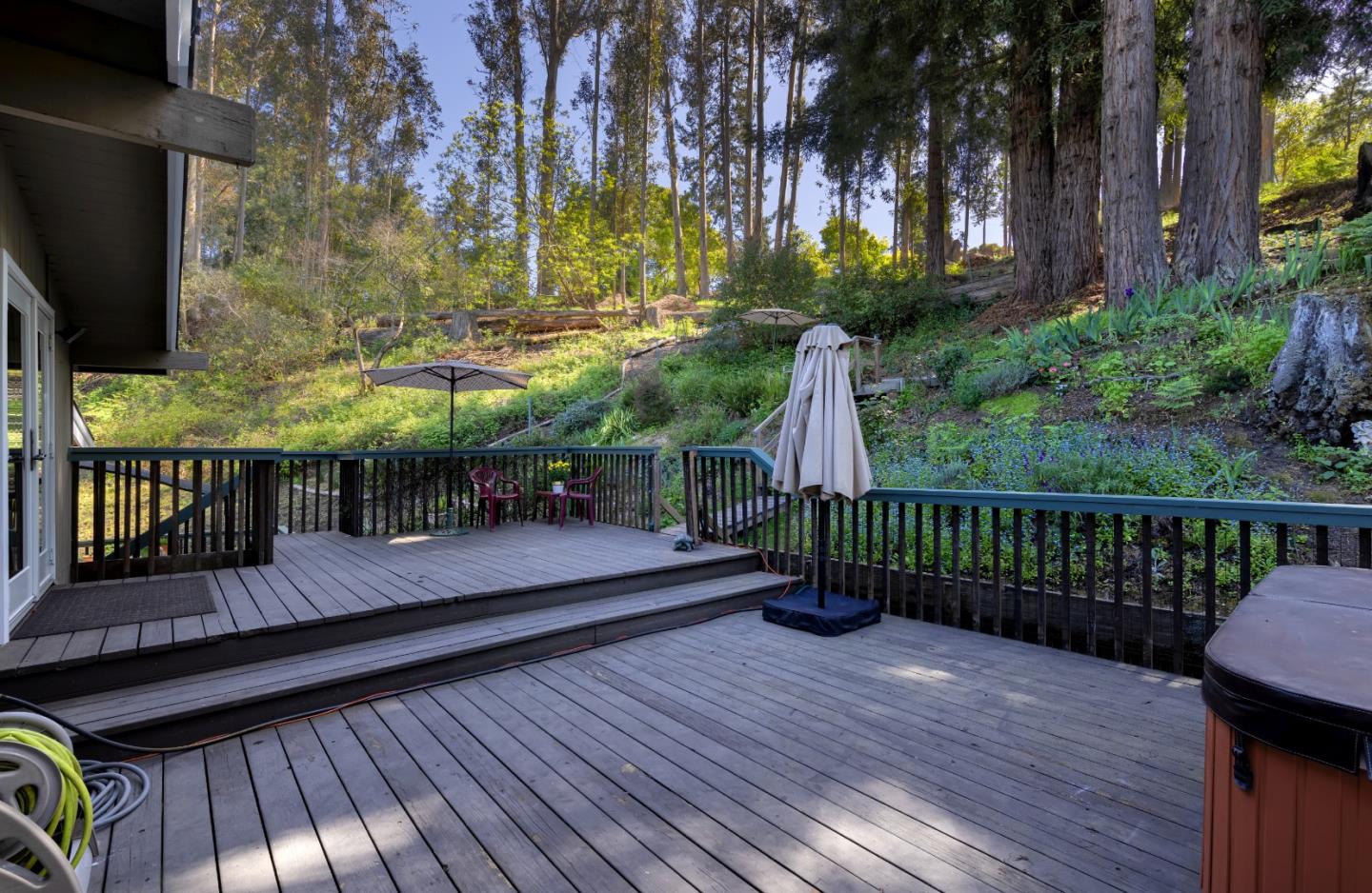 757 Pleasant Valley Road Aptos, CA 95003 - Photo 4 of 41 a view of a balcony with two chairs and wooden floor